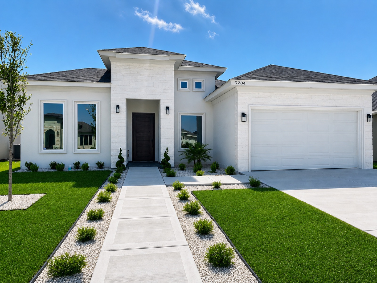 The Santorini, a completed custom home with a landscaped walkway